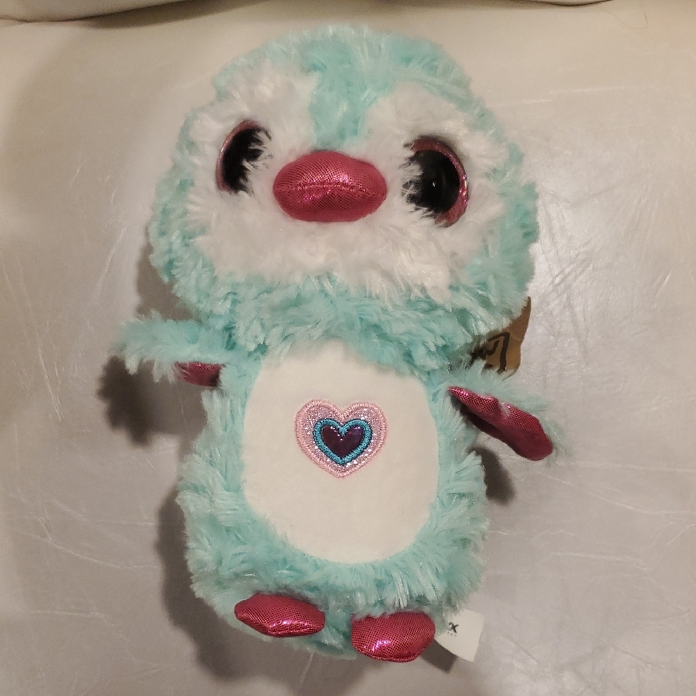 Blue and Pink Stuffed Animal with Fluffy Texture and Adorable Eyes